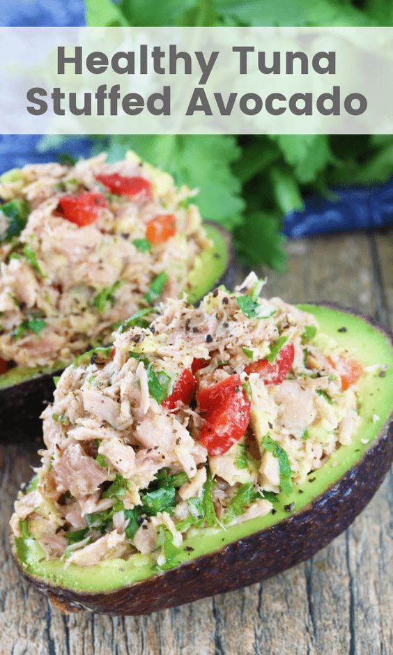 This Healthy Tuna Stuffed Avocado is stuffed with a flavorful southwest mixture of tuna, bell pepper, jalapeno, and cilantro. No mayo necessary here! It's the perfect healthy lunch. #healthytunastuffedavocado #healthyrecipe