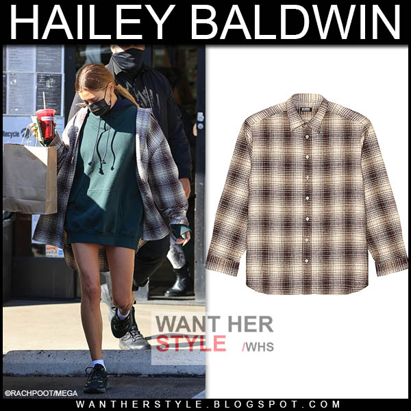Hailey Baldwin in flannel shirt and green hoodie