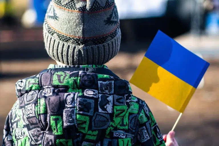 Ukrainian child holds the nation’s flag