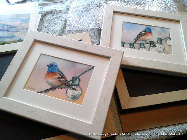 Two watercolors of the Lapis Lazuli bird framed and ready.