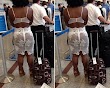 Woman exceeded fashion limits spotted wearing a bra and see through skirt exposing her underwear at the Airport