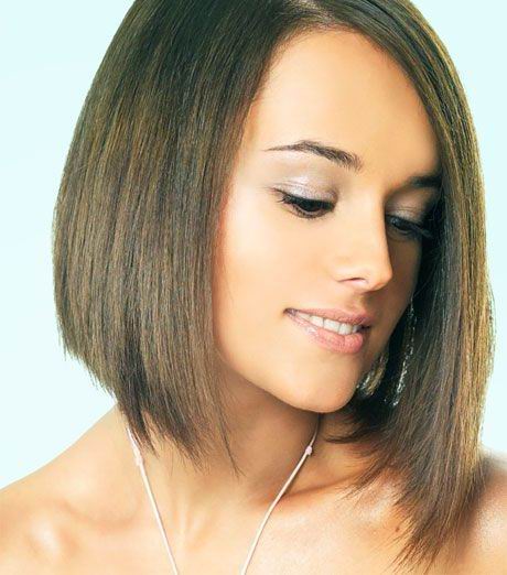 Layers can be cut into a medium bob hairstyle by first determining the