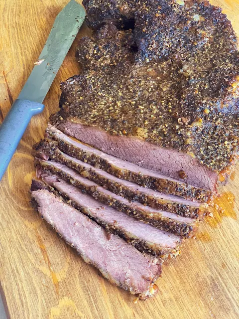 Oven Smoked Brisket is tender meat that tastes like it has been smoked in a smoker for hours.  You don't need a smoker to enjoy this mouthwatering oven smoked brisket.