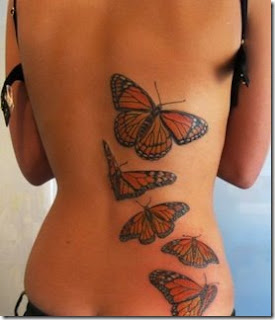 Girl back side butterfly tattoo