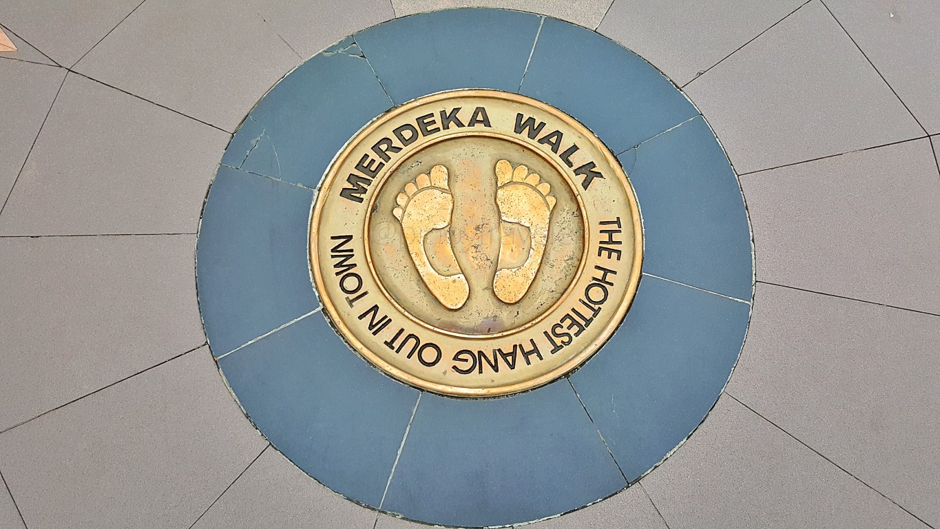 brass signage on the street marking the whole Merdeka Walk of Medan City
