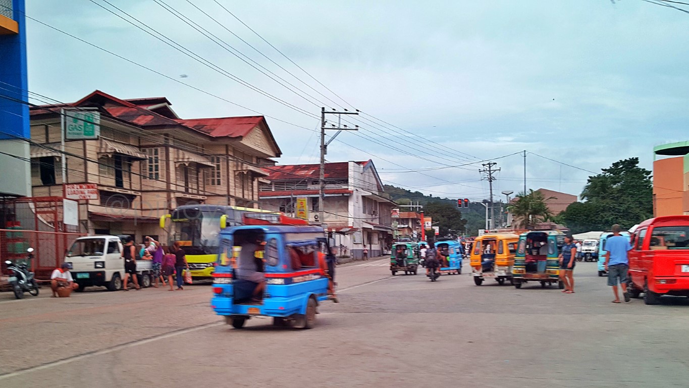 main street (highway) commercial district with old houses in Jagna Bohol