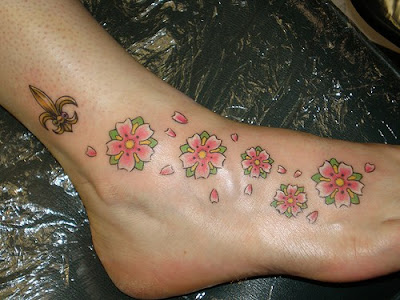 I'd really like a cherry blossom tree tattoo. I love this: and this too