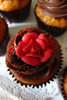 chocolate cupcake with red rose for decoration