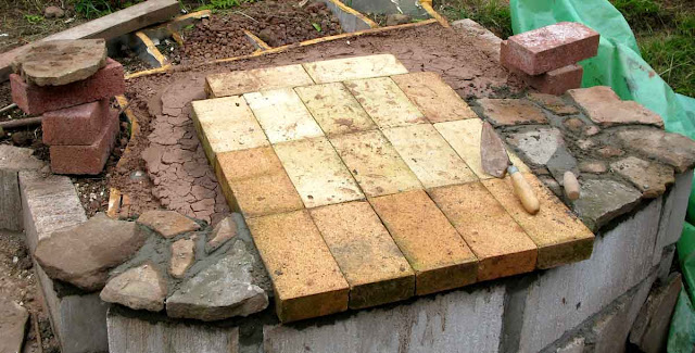 Firebricks laid for the oven floor.