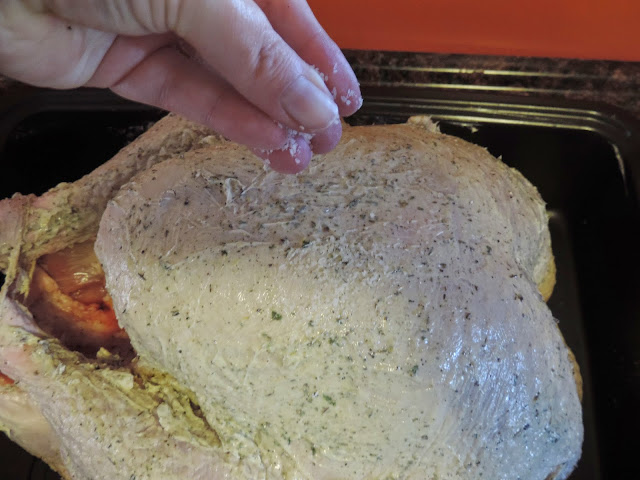 The outside of the turkey being seasoned with salt.