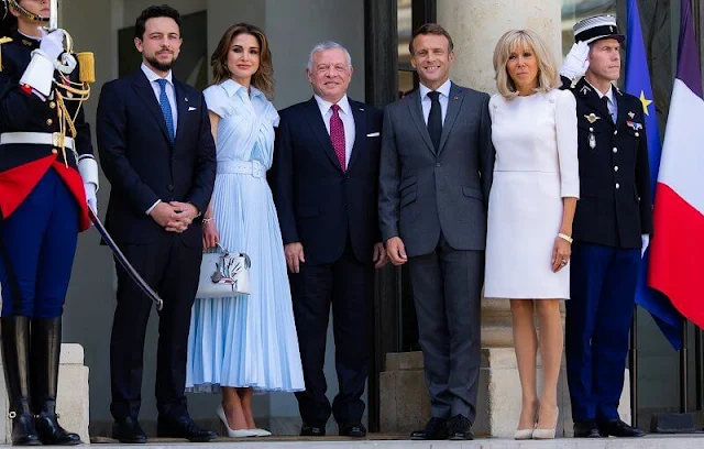 Queen Rania wore a blue draped cotton midi shirt dress by Brandon Maxwell. Emmanuel Macron and Brigitte Macron