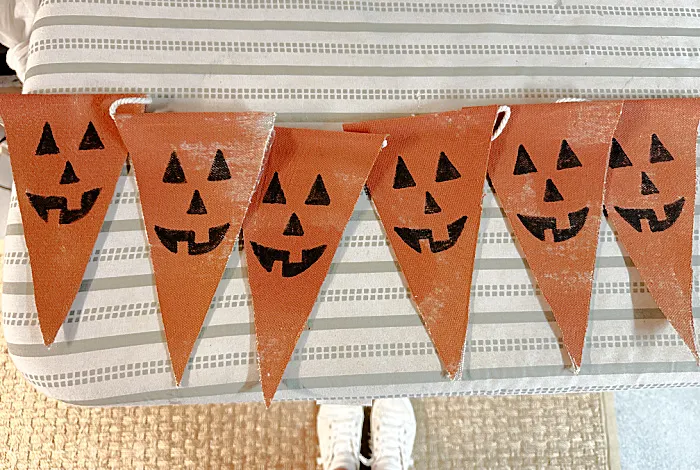 row of jack-o-lantern pennants