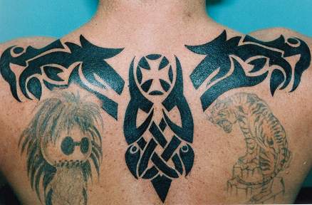 Black ink tribal upper back tattoo
