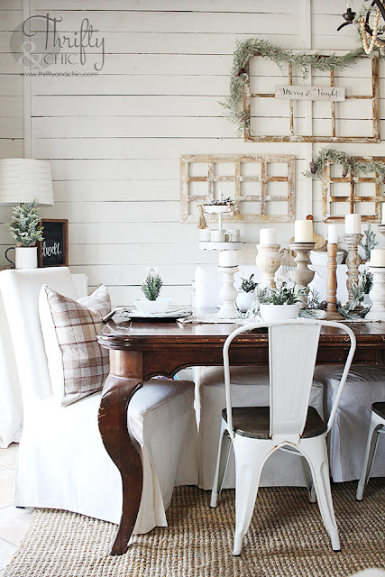 Farmhouse dining room Christmas decor and decorating ideas. Christmas tablescape ideas. Christmas place settings. How to decorate your dining room for Christmas. Dining room wall christmas decor. Dining room with shiplap walls. Neutral christmas dining room decor. Candlestick tablescape.