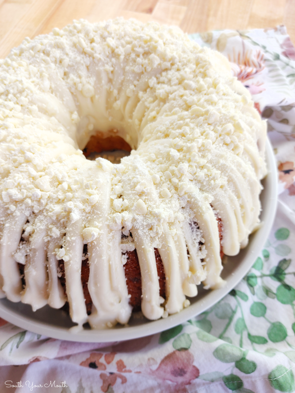 White Chocolate Berry Bundt Cake! An easy, absolutely DELICIOUS recipe for tender white chocolate cake with a berry swirl based on Nothing Bundt Cakes famous White Chocolate Raspberry cake.