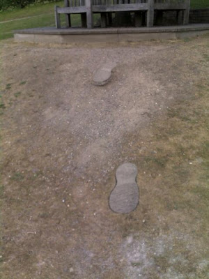 Giant footprints leading to Roald Dahl's grave