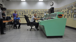 Workers in the control room of Kosovo A, a Tito-era coal plant the government wants to replace (Photo Credit: Karl Mathiesen) Click to Enlarge.