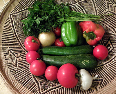 Basket of veggies: zucchini, tomatoes, red and green bell pepper, parsley, onion, garlic