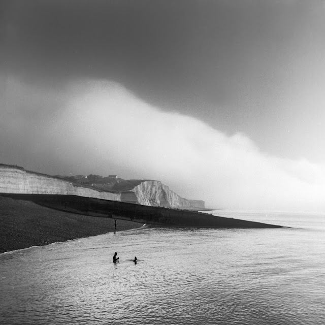 People swimming in the sea in the winter at Saltdean East Sussex