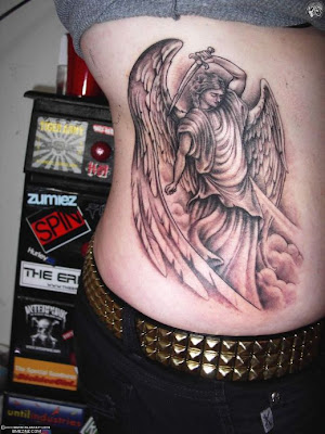 An elegant angel tattoo done on the arm in black ink looking beautiful