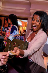 Tsogo Sun Rewards -  Katlego Mohaoduba handing over her Tsogo Sun rewards card for more benefits