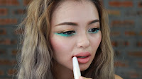 St. Patrick's Day Makeup - Apply nude color lipstick on your lip