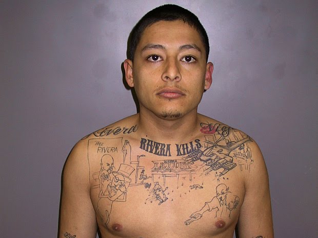 Inked on the pudgy chest of a young Pico Rivera gangster who had been picked