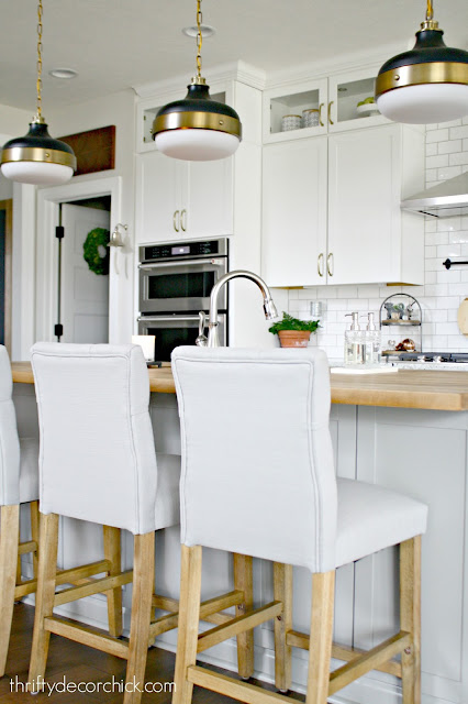 Soothing light gray and white kitchen with wood accents