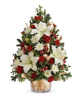 Christmas tree decorated with lilies and roses