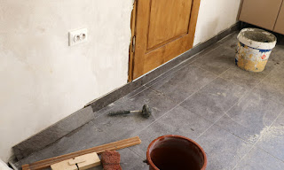 The very last edging tile is fitted in the kitchen