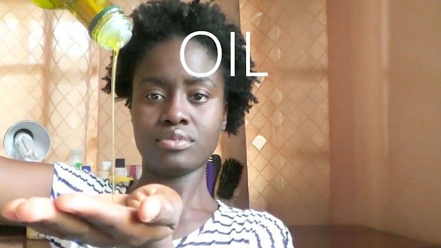 Putting olive oil in hair