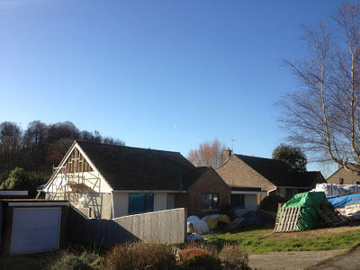 blue sky, sunshine and half a cedar-clad gable