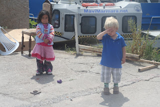 Anton having a paddy and ignoring the Roma girl offering him a flower