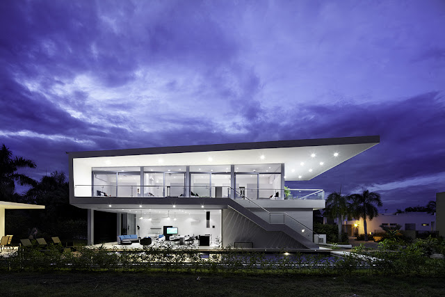Side view of modern home at dusk 