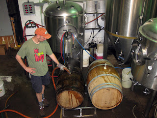 Scott cleaning out barrels before filling them with kvass.