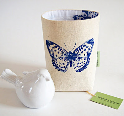 off-white cotton canvas bin with blue butterfly; blue pattern on the interior, too