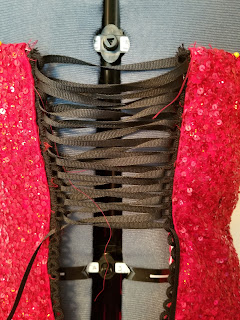 Close up of the original, black lacing. It is loosely laced most of the way down.