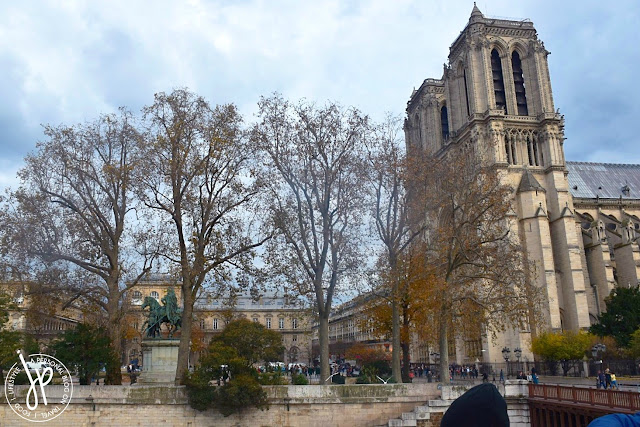 church, tourists, statue, trees