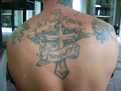 Angel cross tattoo spreading wings on the back and big angel Irish cross