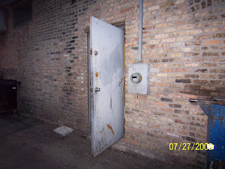 New Jeanny's back door propped open to dirty alley - 7/27/09