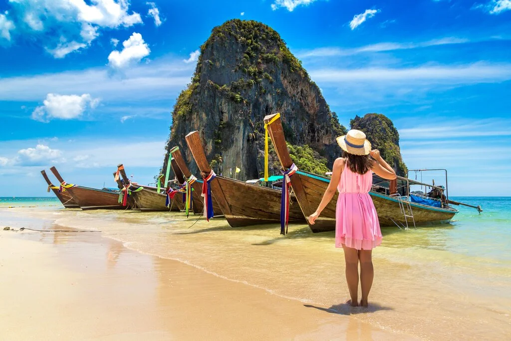 "Discover the Best of Thailand: A Travel Guide to Paradise" Thailand is a popular destination for tourists from around the world. Known for its beautiful beaches, historic sites, delicious food and friendly locals, it's no wonder why so many people choose to travel to this Southeast Asian country. Here are some key points to consider when planning your next trip to Thailand.    ## Beaches   Thailand is famous for its stunning beaches that attract visitors from all over the globe. From Phuket and Krabi in the south to Koh Samui and Pattaya on the east coast , there are plenty of options when it comes to finding your perfect beach getaway. Whether you're looking for secluded coves or bustling party scenes, Thailand has something for everyone.    ## Culture    Thailand has a rich cultural heritage with ancient temples and palaces scattered throughout the country.These historical sites offer an insight into Thai history & religion .One must definitely visit Grand Palace & Wat Phra Kaew in Bangkok as they play important role in Thai monarchy .    ## Food    Thai cuisine is renowned across world thanks to its unique blend of sweet,sour,salty & spicy flavors.From street side vendors selling Pad Thai (Stir Fried Noodles) & Som Tam(Papaya Salad)to fine dining restaurants serving Massaman Curry,Crispy Pork Belly etc., one can never get enough of these dishes during their stay in Thailand .    ## Nightlife    When night falls,Thailand truly comes alive with vibrant nightlife scene catering every taste from bars playing live music ,nightclubs blasting bass-heavy beats till dawn,Khaosan Road which offers backpackers cheap drinks along with street performers showcasing their talent making every moment memorable.    ## Shopping   Shopping enthusiasts will be spoilt for choice as Thailand has everything from traditional markets like Chatuchak Weekend Market offering wide range products at cheap prices  ,luxury shopping malls such as Siam Paragon giving high-end brands experience alongside local designer boutiques located around Sukhumvit area.    Overall, Thailand is a destination that offers something for everyone. Whether you're looking to relax on the beach, explore ancient temples or indulge in delicious food and exciting nightlife, this country has it all. So pack your bags and get ready for an adventure in the land of smiles!