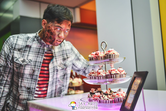 Zombie eying for the cupcakes with eyes on it