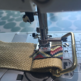 Affix webbing to hardware with sewing machine