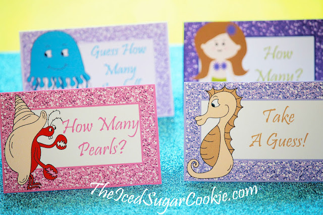 DIY Mermaid Under The Sea Birthday Party Printables-Food Label Tent Cards, Cupcake Toppers, Flag Garland Hanging Banner-Purple Glitter Digital Download Template-Seahorse, Jellyfish, Hermit Crab Chocolate Sea Shells, Fish Eggs, Ocean Waves, Mermaid Sandwiches How many Pearls, Take A Guess, Guess How Many Seashells, How Many?