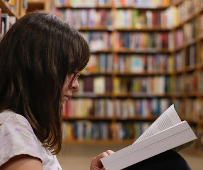 woman reading in library