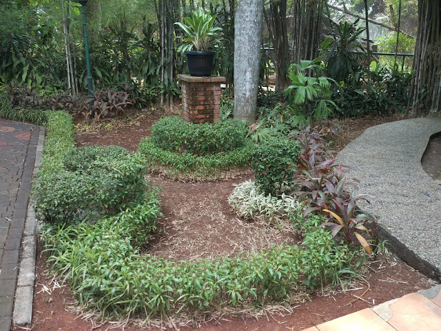 Small garden with small brick tower