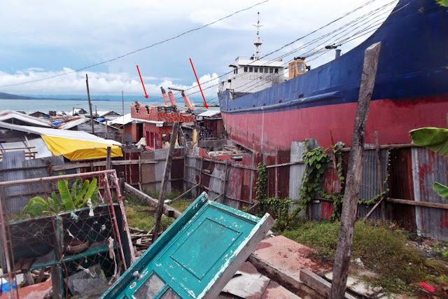M/V Eva Jocelyn cargo ship and the houses it trampled upon during superstorm yolanda