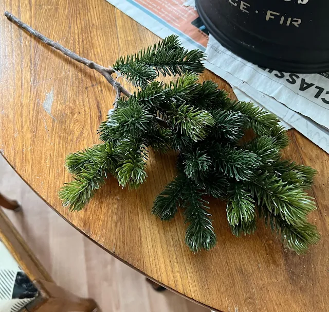 Photo of a plastic stemmed faux greenery pick for a Porch Pot.