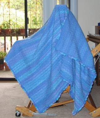 Completed space dyed yarn afghan.