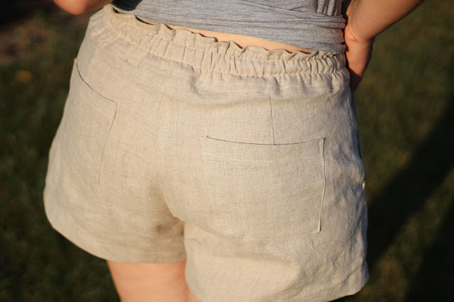 back detail image of paper bag waistband and patch pocket with back darts